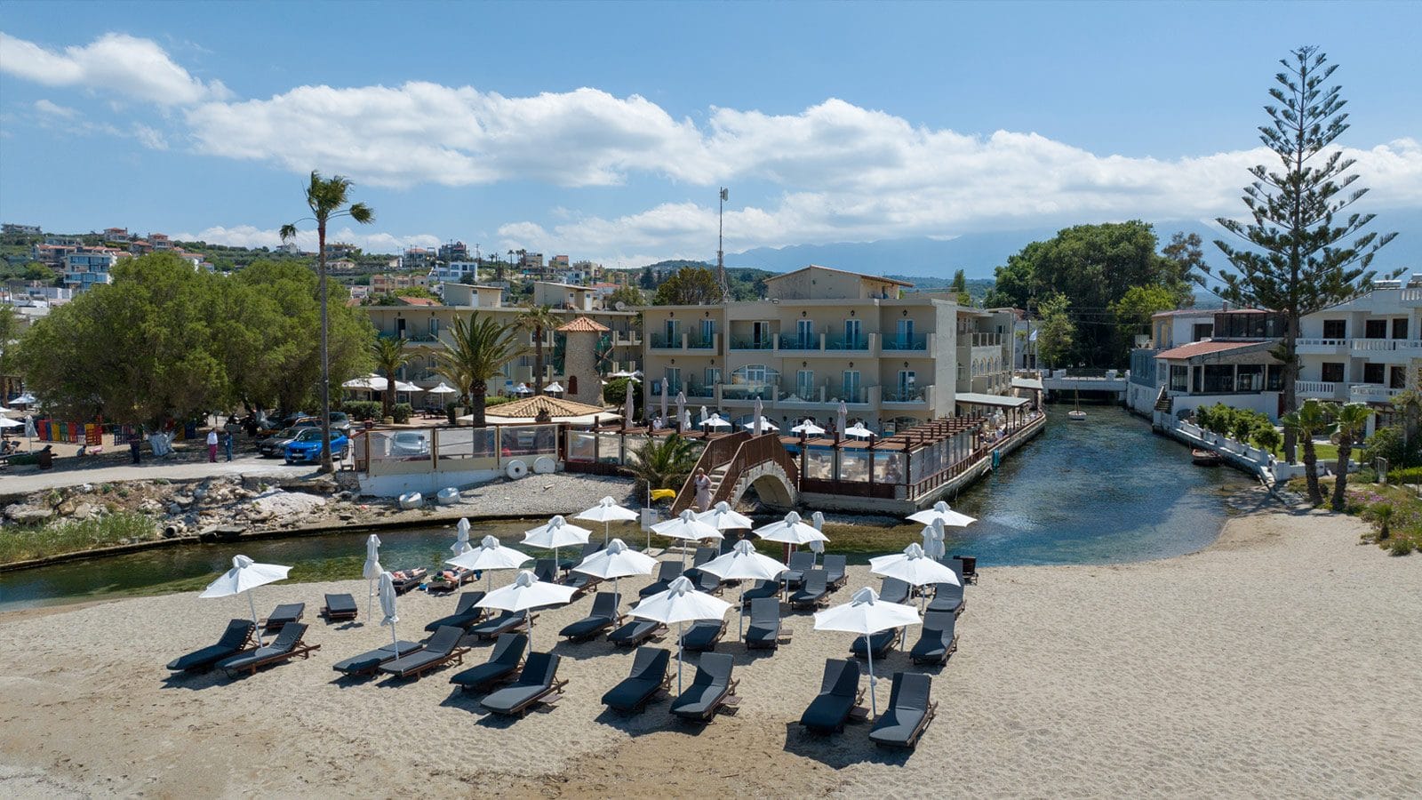a beach with many umbrellas