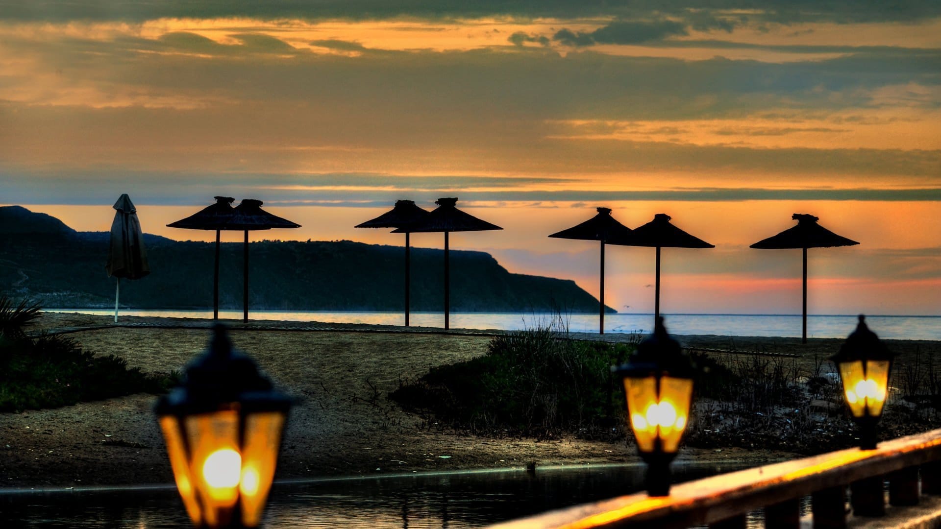 a row of umbrellas on a beach