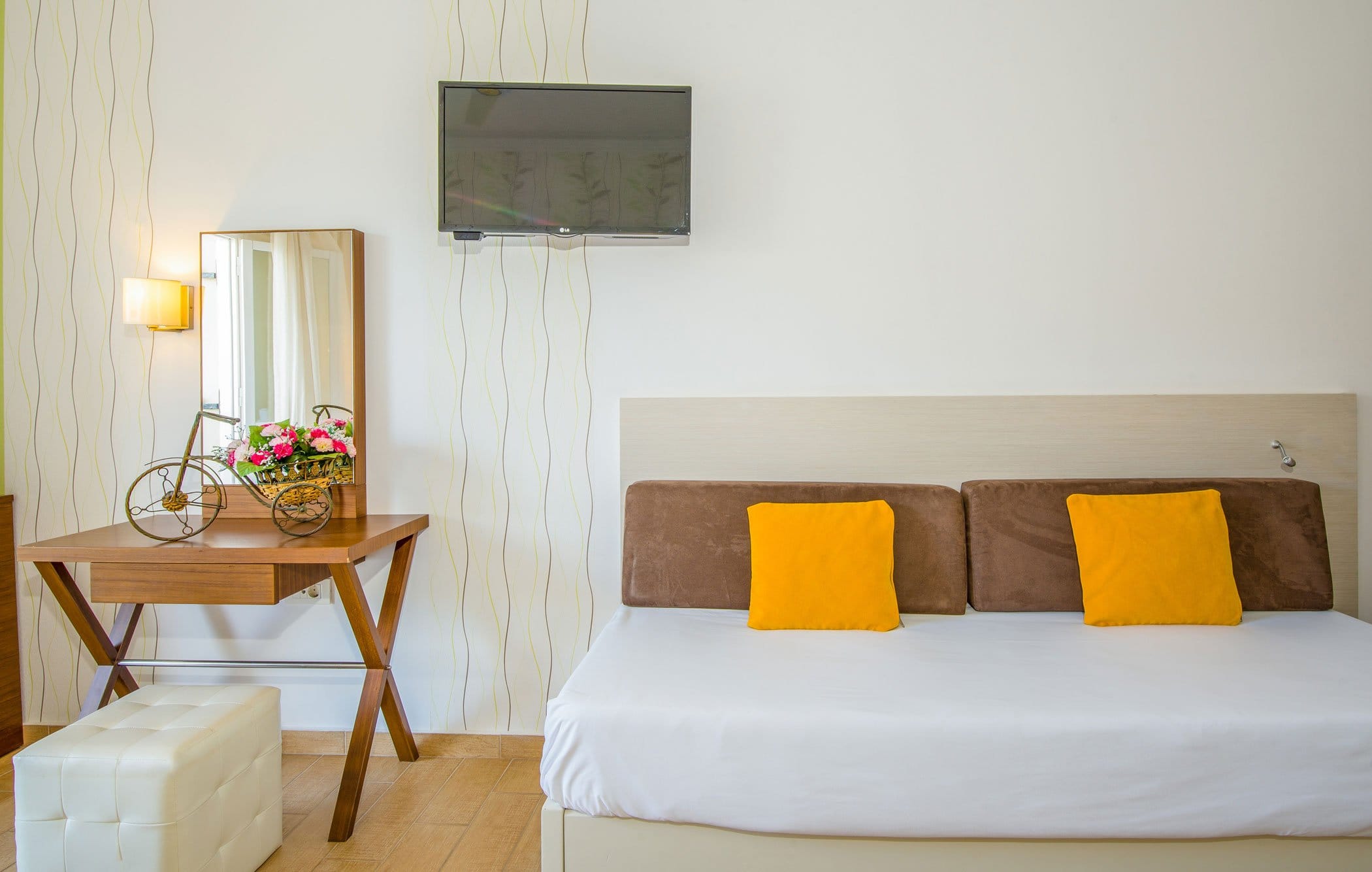 a bed with orange pillows