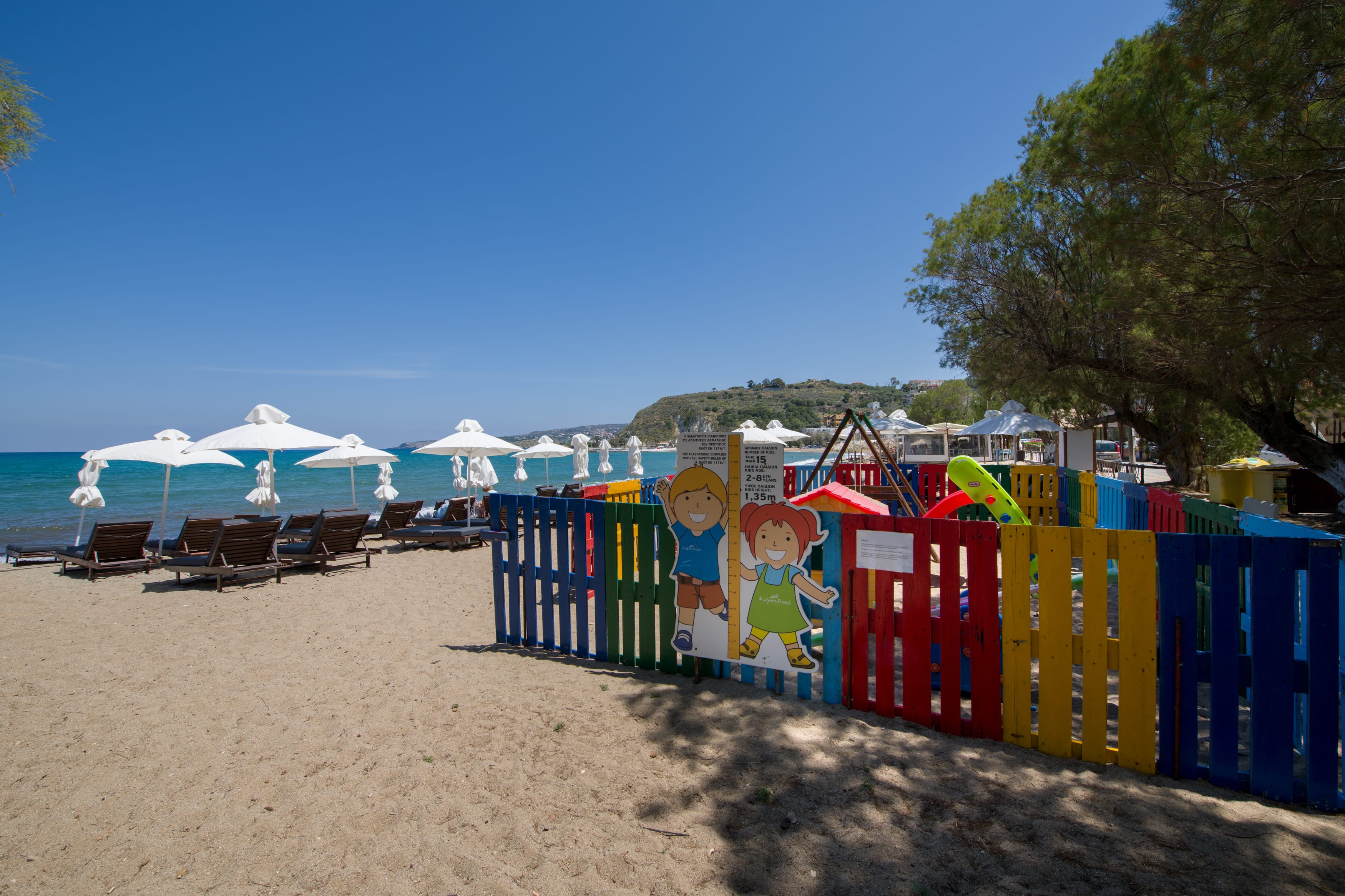 a beach with many umbrellas