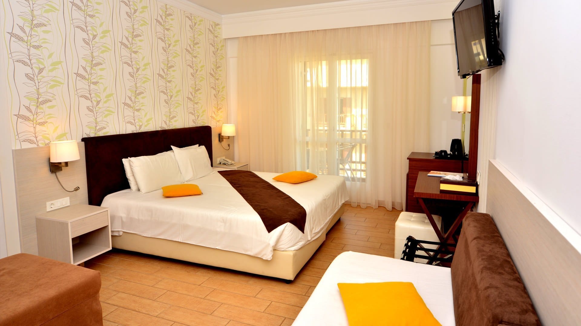 a bedroom with a bed and a tv