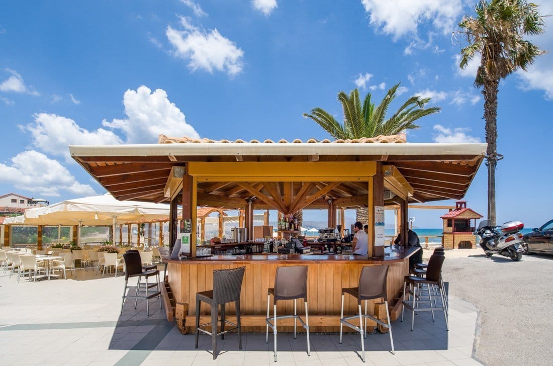 a table with chairs and umbrellas