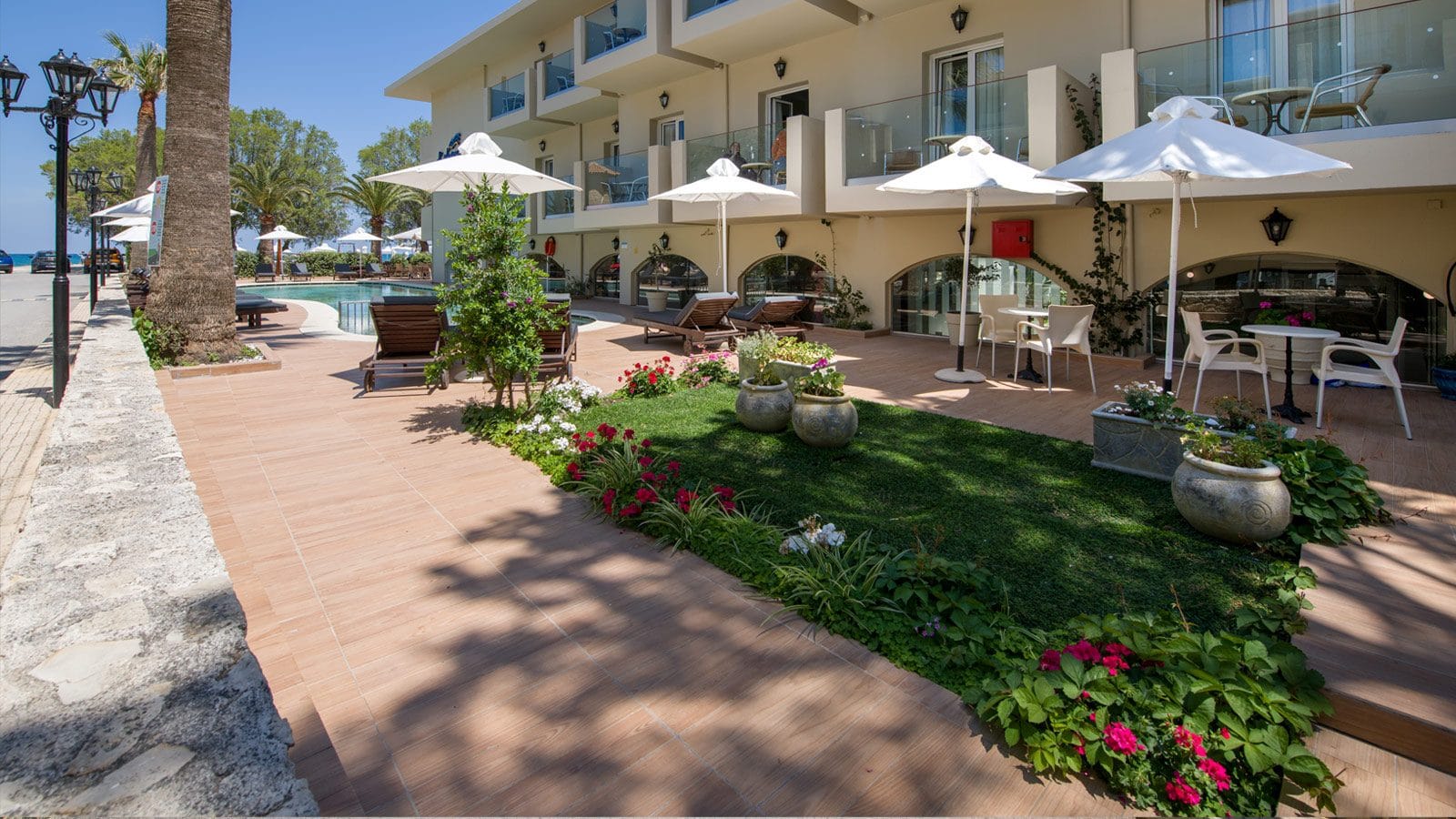 a courtyard with tables and chairs
