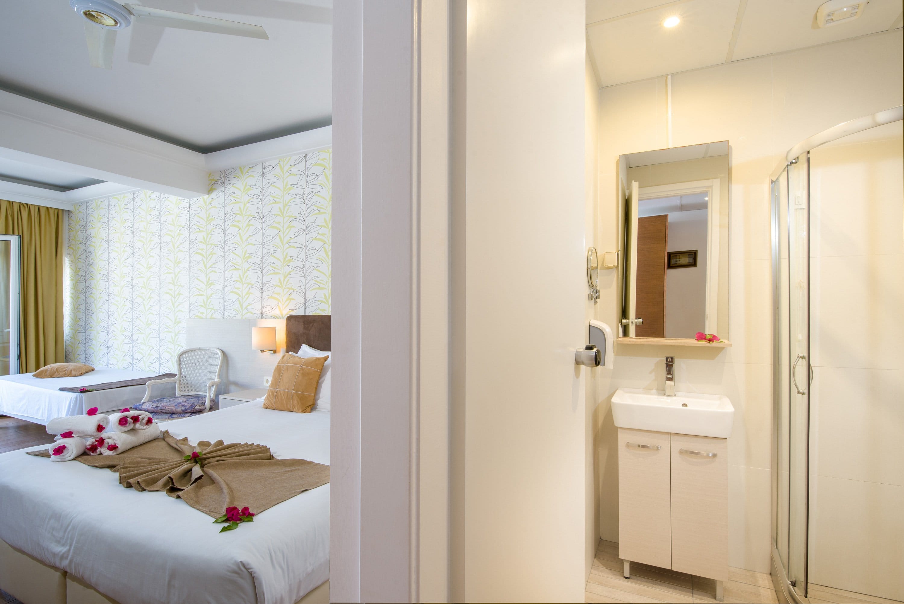 a bathroom with a bed and a sink