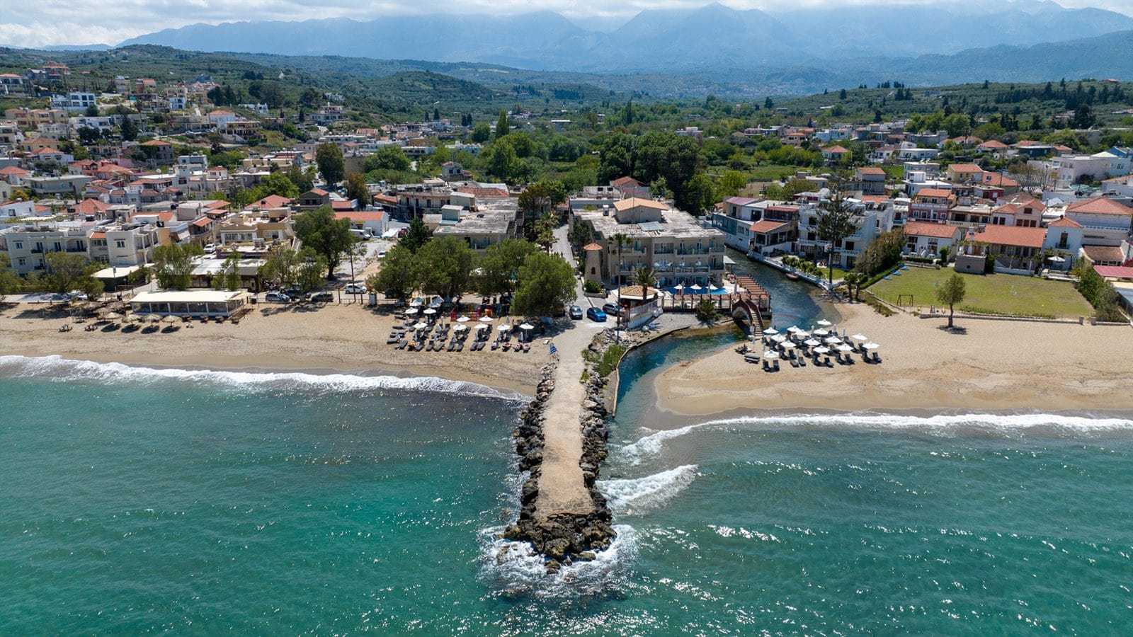 a beach with houses and trees