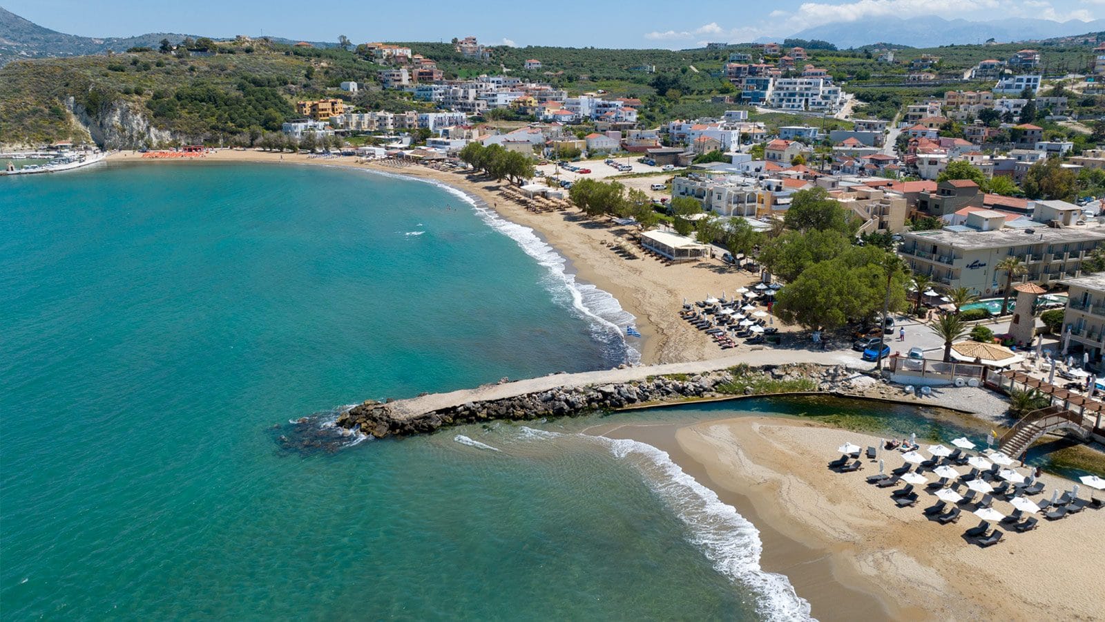 a beach with houses and trees