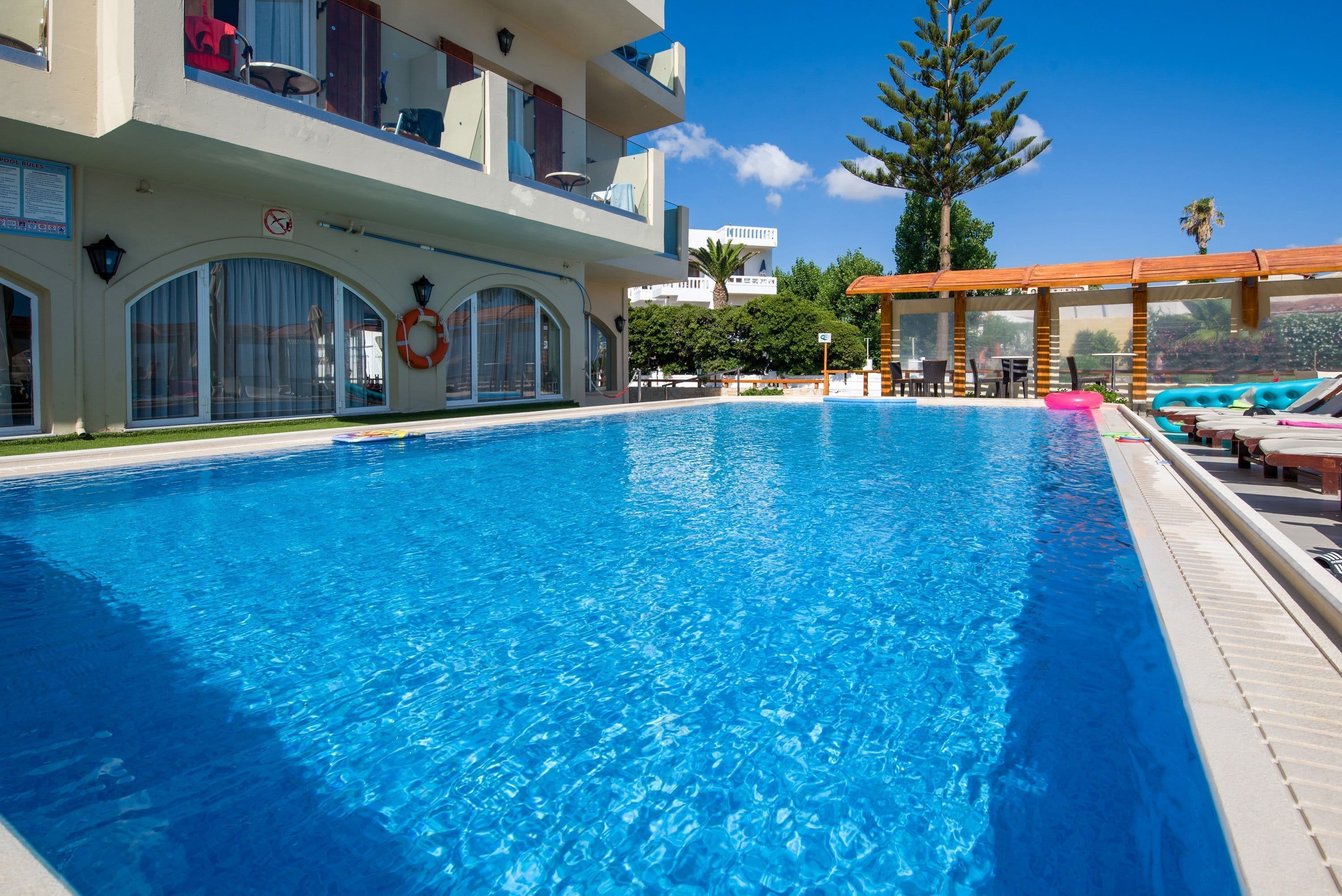 a swimming pool in front of a building