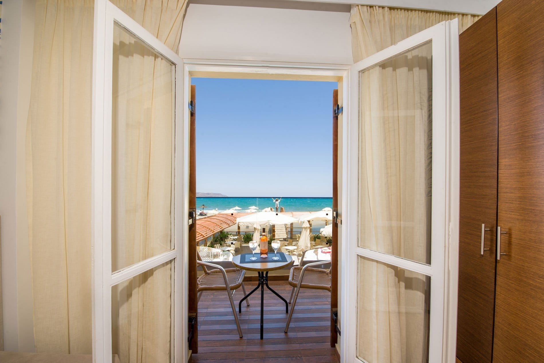 a dining room with a view of the ocean