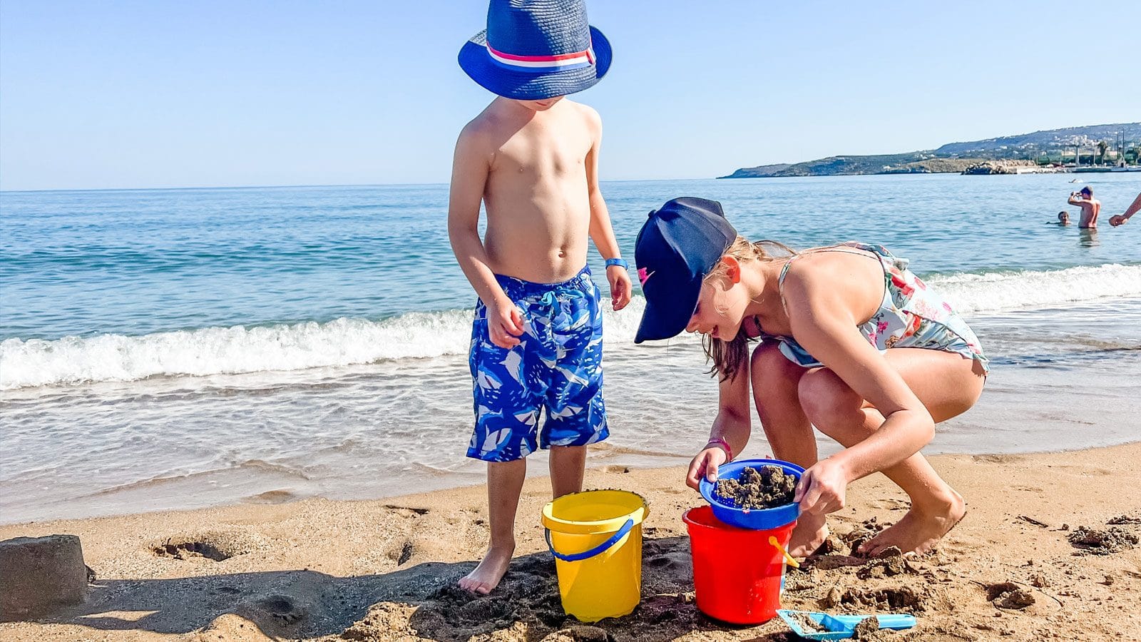 a group of people playing on a beach