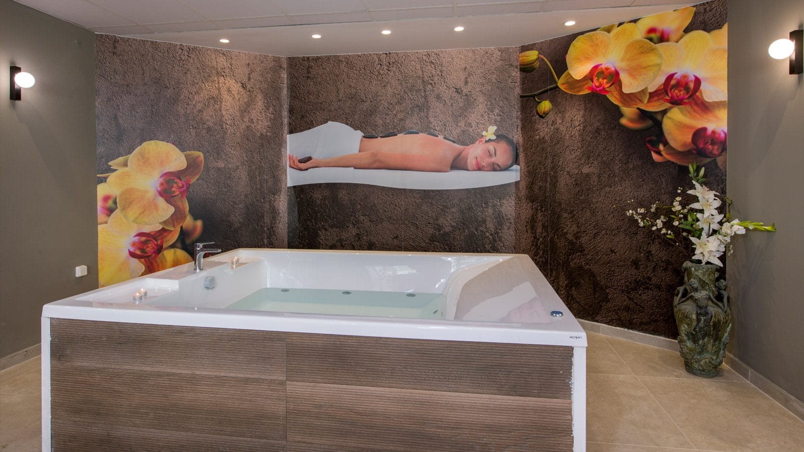 a bathtub with a painting on the wall