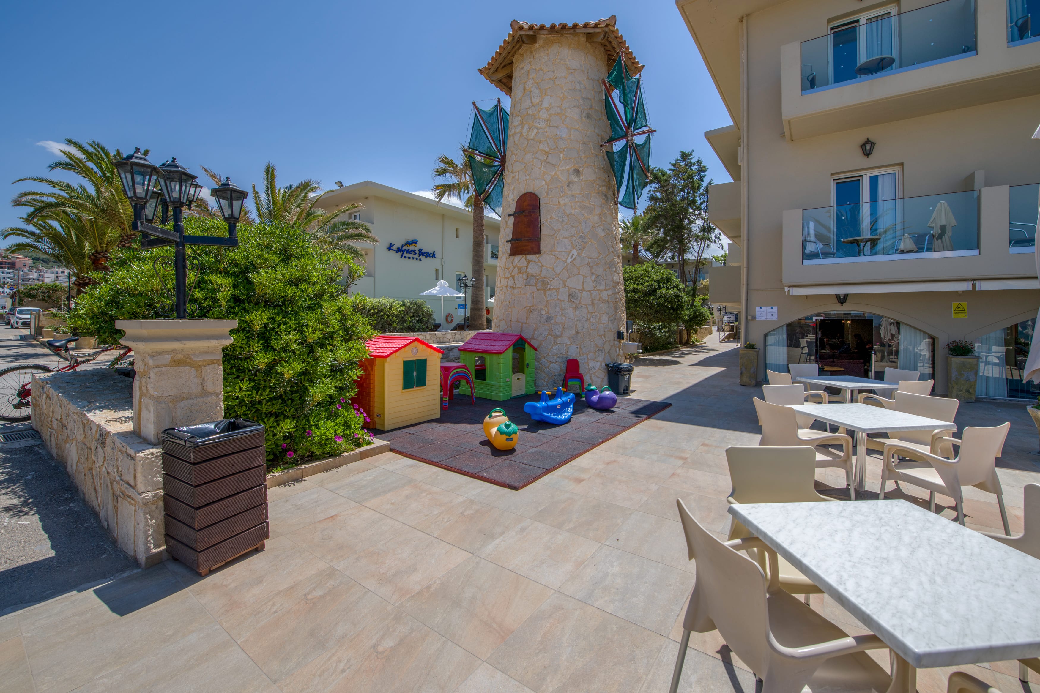 a patio with tables and chairs
